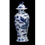 A 19TH CENTURY BLUE AND WHITE CHINESE BALUSTER VASE AND COVER WITH DOG OF FO FINIALS decorated