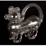 AN UNUSUAL 19TH/20TH CENTURY CLEAR GLASS DECANTER modelled as a dog, 23cm across 18cm high