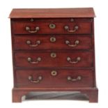 A SMALL GEORGE II MAHOGANY CHEST OF DRAWERS with two small and three long graduated drawers above an