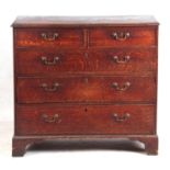 A GEORGE III OAK CHEST OF DRAWERS fitted two small and three long graduated drawers with h swan-neck