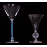 A STYLISH R LALIQUE COCKTAIL GLASS with plain flared bowl on a blue stained figural stem and knopped