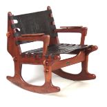 A 20TH CENTURY TEAK ROCKING CHAIR BY ANGEL PAZMINO ECUADOR (CIRCA 1970) with embossed leather back