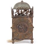 A VERY ORIGINAL LATE 17TH CENTURY NORTHERN LANTERN CLOCK the case surmounted by a steel bell