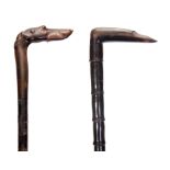 TWO 19TH CENTURY HORN WALKING CANES the first modelled as a dogs head, possibly rhino horn, with