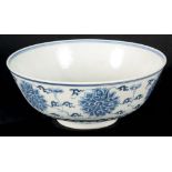 AN EARLY CHINESE BLUE AND WHITE BOWL the body decorated with flowerheads, the interior with double-
