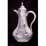 A VICTORIAN SILVER MOUNTED CUT GLASS CLARET JUG the panelled pear-shaped body with floral and