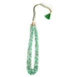 A GRADUATED OVAL EMERALD BEAD NECKLACE 52cm long