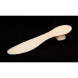 AN 18TH CENTURY IVORY SHOE HORN SHAPED AS HEELED SOLE OF A SHOE with a nailed tortoiseshell tipped