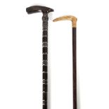 AN EARLY 20TH CENTURY RING TURNED HORN WALKING STICK having shaped handle 85.5cm overall TOGETHER