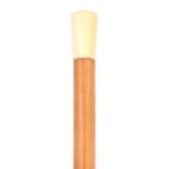 A 19TH CENTURY MALACCA AND IVORY WALKING STICK with a tapered pommel 92.5cm overall