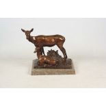A VERY LARGE ART DECO PATINATED BRONZE SCULPTURE modelled as a standing deer with fawn on a