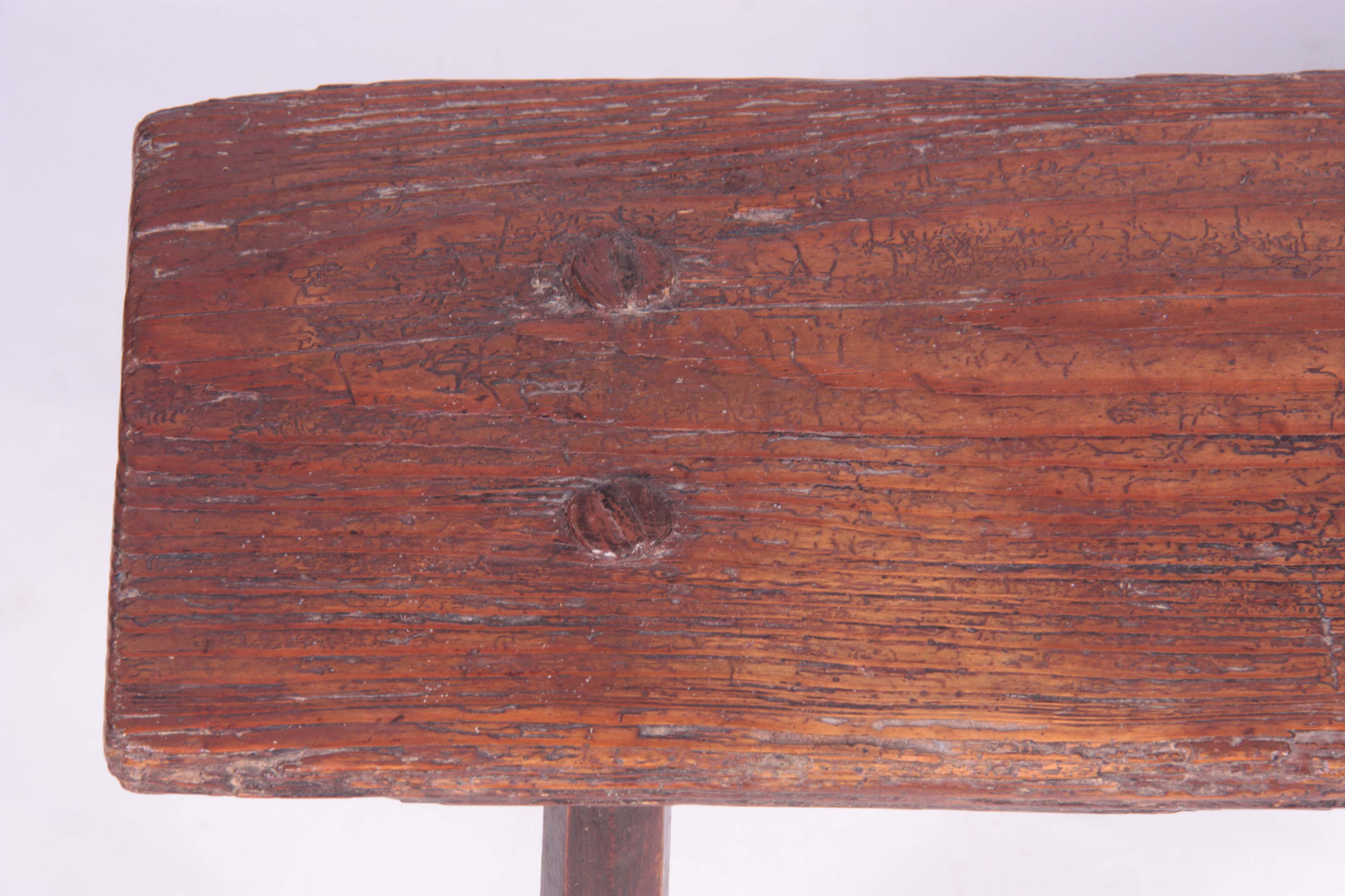 A PRIMITIVE 18TH CENTURY ELM PIG BENCH raised on four chamfered legs 77.5cm wide 24cm deep 35cm - Image 3 of 5