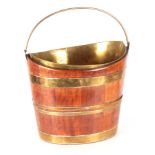 A LATE 18TH CENTURY MAHOGANY SHAPED OVAL OYSTER BUCKET with folding brass handle and liner, having