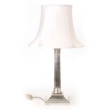 A LARGE EDWARD VII SILVER CORINTHIAN COLUMN TABLE LAMP with reeded tapering column on a stepped
