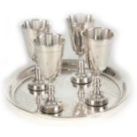 A SET OF FOUR EARLY 20TH CENTURY JUDAICA GOBLETS ON MATCHING SALVER the goblets with zigzag engraved