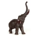 A LARGE MEIJI PERIOD JAPANESE PATINATED BRONZE SCULPTURE modelled as a standing elephant 46cm