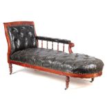 A 19TH CENTURY MAHOGANY BLACK LEATHER BUTTON UPHOLSTERED CHAISE LONGUE with shaped backrest and