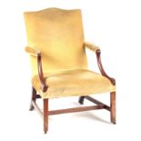 A GEORGE III MAHOGANY GAINSBOROUGH CHAIR with camel shaped back above open arms with sweeping