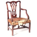A GEORGE III MAHOGANY CHIPPENDALE STYLE OPEN ARMCHAIR with carved acorn top rail above a gothic