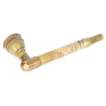 AN EARLY ORIENTAL JADE PIPE with a turned bowl and brass corner bracket 16cm overall.
