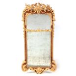 A FINE GEORGE I WALNUT AND GILT GESSO HANGING MIRROR OF LARGE PROPORTIONS with Rococo style carved