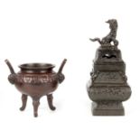 A CHINESE BRONZE CENSER of square baluster form, the pierced lid surmounted by a foo dog and ball