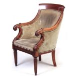 A REGENCY MAHOGANY LIBRARY CHAIR with green suede upholstery having a curved top rail above sweeping
