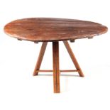AN EARLY 19TH CENTURY CONTINENTAL PINE FARMHOUSE TABLE with circular top above a tripod base