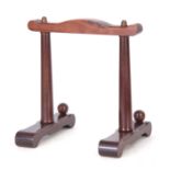 A 2OTH CENTURY CHINESE HARDWOOD PLATE STAND with a pagoda-shaped top and column supports 32cm high