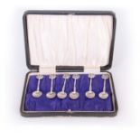 A SET OF SIX EDWARD VII GOTHIC STYLE CAST SILVER COFFEE SPOONS with Galleon topped figural stems and