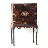 AN EARLY 18TH CENTURY AND LATER JAPANNED CHINOISERIE CABINET ON STAND with later brass mounts and