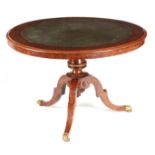 A STYLISH REGENCY BURR YEW-WOOD CIRCULAR TILT TOP LIBRARY TABLE the ebony banded green tooled