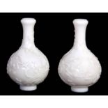 A PAIR OF 19TH CENTURY CHINESE BULBOUS CAMEO GLASS VASES bearing four-character Qing dynasty mark to