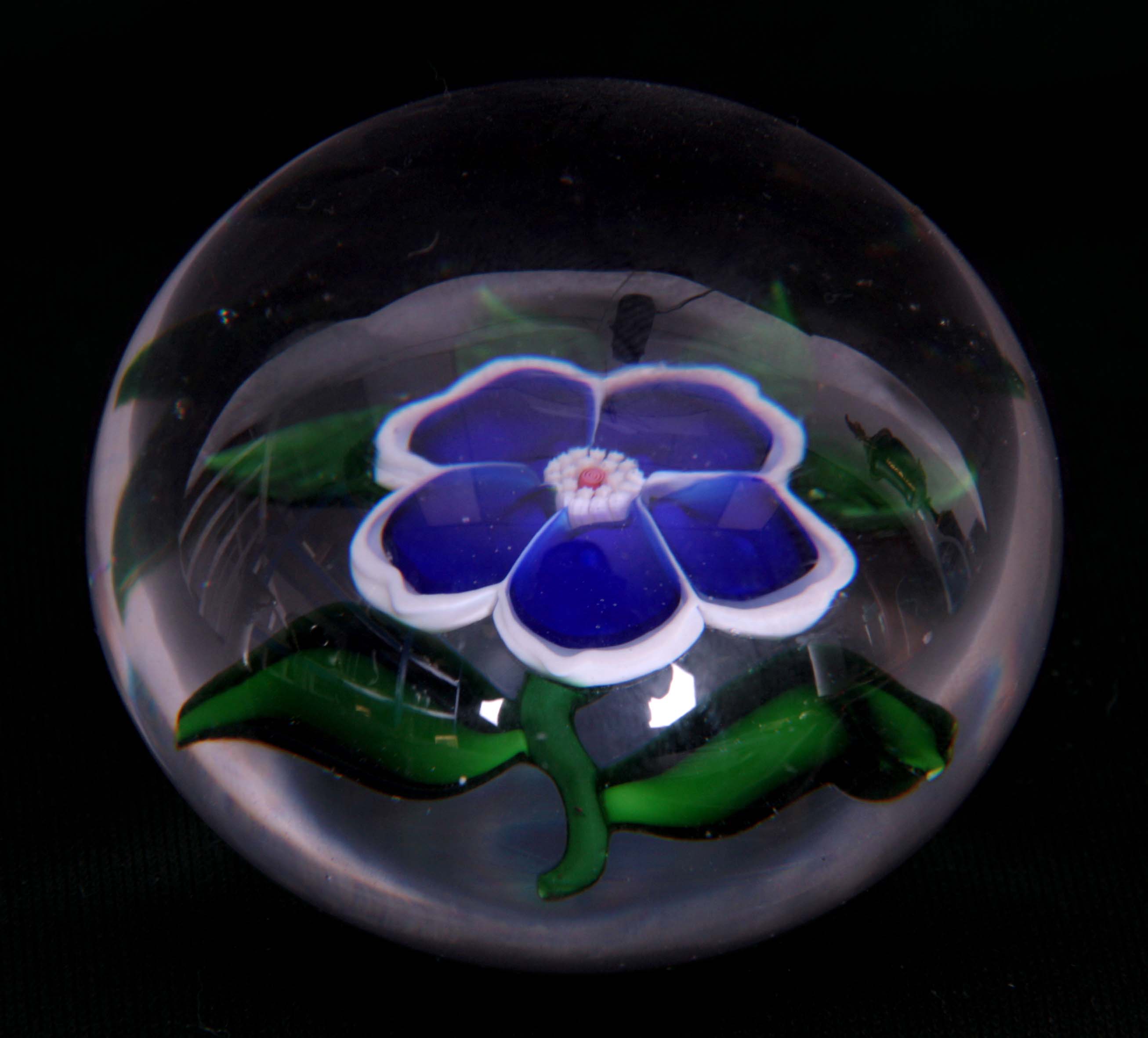 A 19TH CENTURY BACCARAT BLUE PANSY SPRAY PAPERWEIGHT with star cut base 6cm diameter