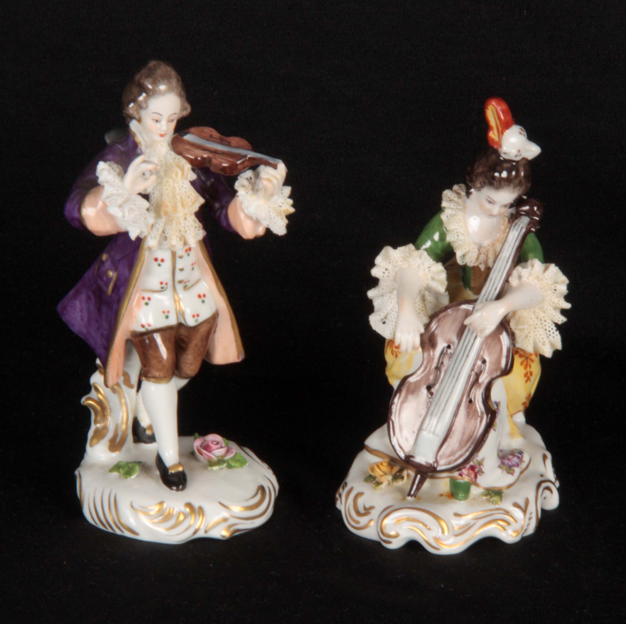 A PAIR OF GERMAN DRESDEN STYLE CLASSICAL MUSICIAN FIGURES modelled as a violinist and cellist, on