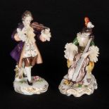 A PAIR OF GERMAN DRESDEN STYLE CLASSICAL MUSICIAN FIGURES modelled as a violinist and cellist, on