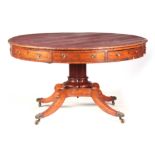 A LARGE WILLIAM IV OAK DRUM TABLE with circular tooled leather top above a shallow frieze with