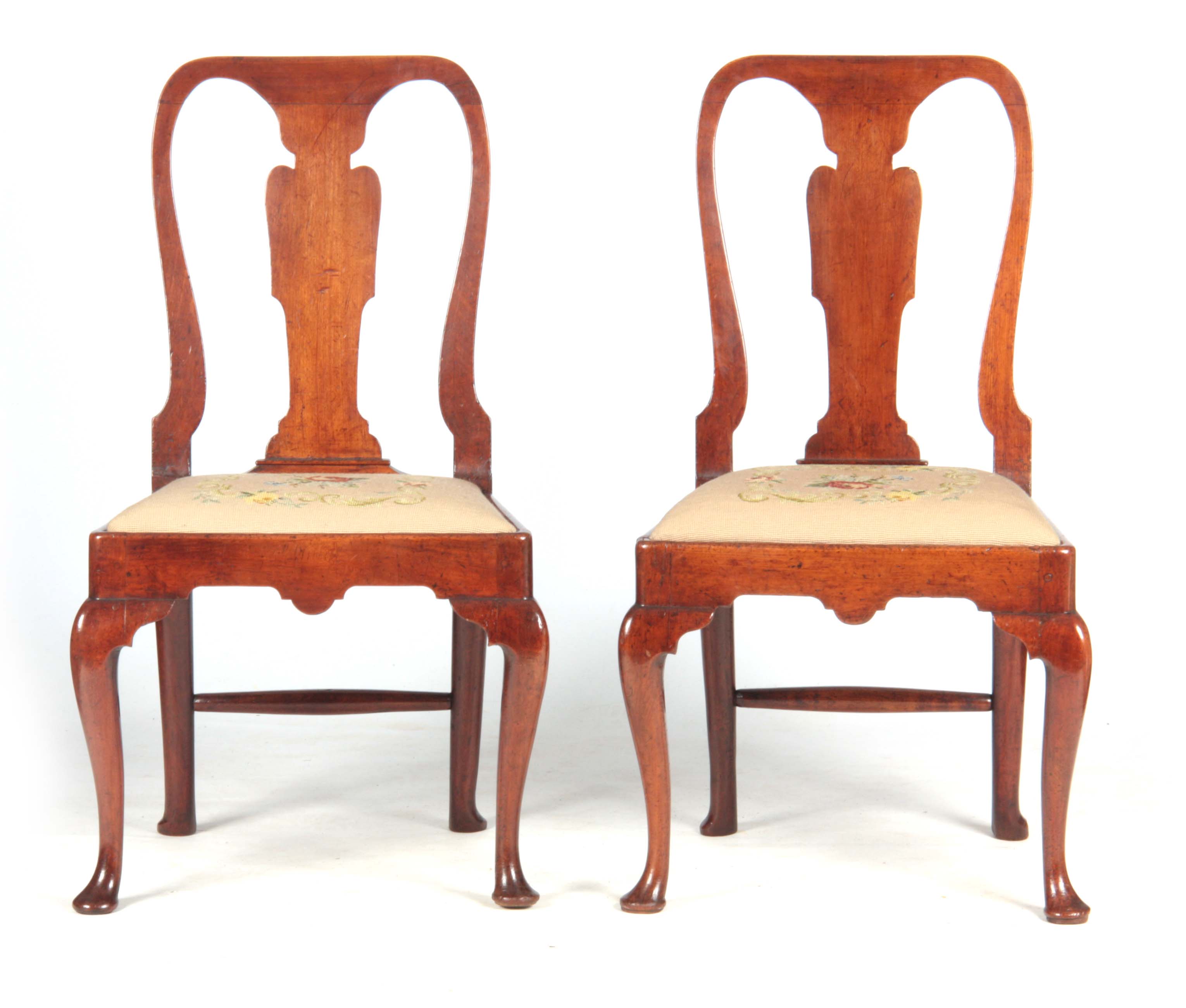 A PAIR OF GEORGE I WALNUT SIDE CHAIRS with shaped backs and vase back splats, drop-in tapestry