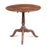 AN UNUSUAL EARLY 18TH CENTURY OAK TILT TOP TABLE with plank top and turned bulbous stem standing