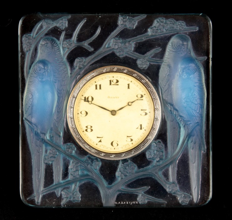 AN R LALIQUE INSEPARABLES OPALESCENT CLOCK WITH BLUE TINTING 1920's of square relief moulded form