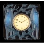 AN R LALIQUE INSEPARABLES OPALESCENT CLOCK WITH BLUE TINTING 1920's of square relief moulded form