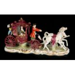 A GERMAN DRESDEN STYLE VIEUX SAXE FIGURE GROUP modelled as a carriage and horses set with figures,