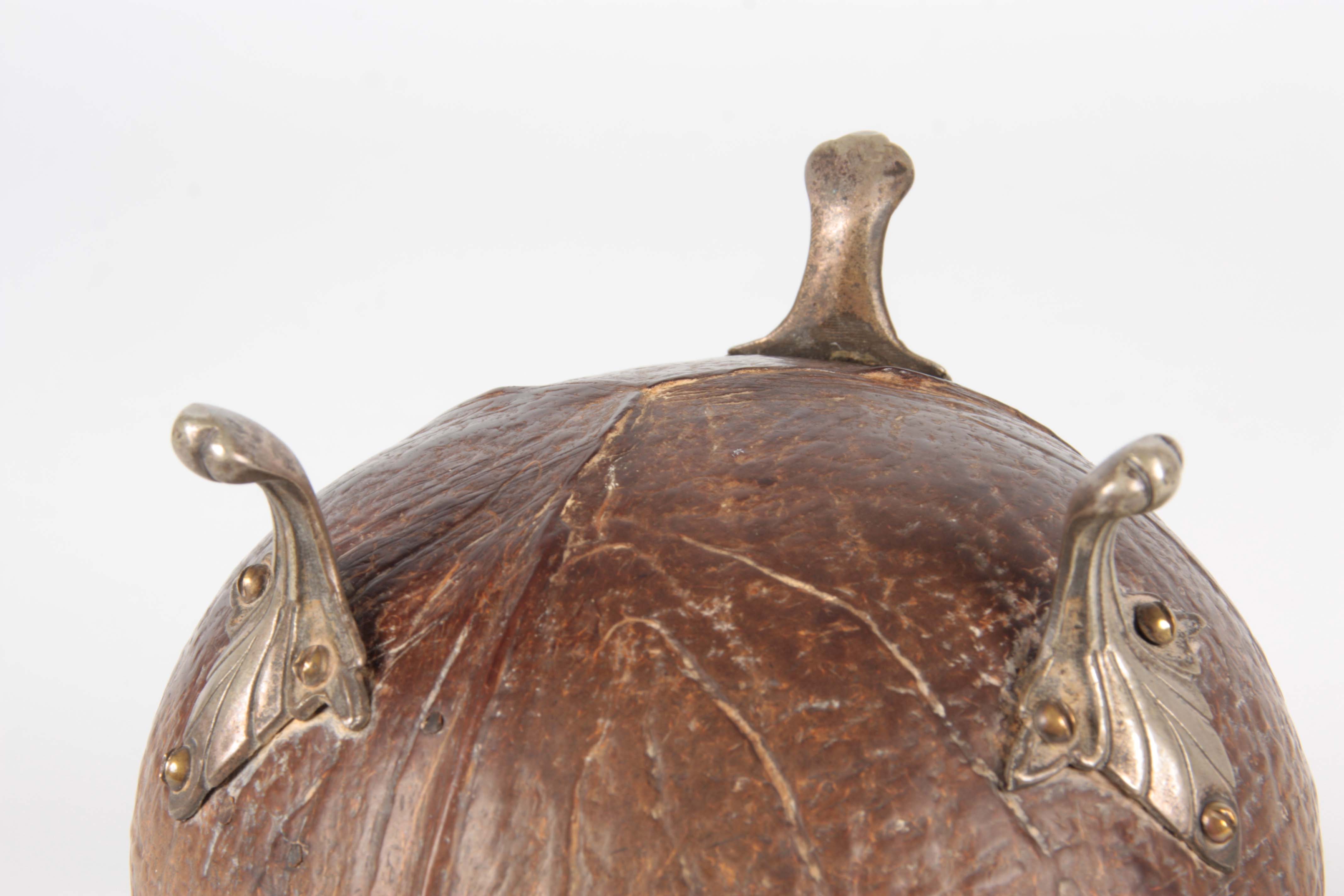 A 19TH CENTURY COCONUT CADDY with silver metal mounts and raised splay feet, the domed lid with - Image 11 of 12