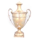 AN EDWARD VII SILVER TWO-HANDLED TROPHY CUP of pedestal form bearing presentation inscription 22cm