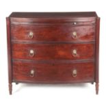 A REGENCY FIGURED MAHOGANY BOW FRONT CHEST OF DRAWERS IN THE MANNER OF GILLOWS with reeded moulded