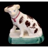 A 19TH CENTURY STAFFORDSHIRE POTTERY HATPIN HOLDER FORMED AS A DOG decorated with brown spots,