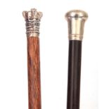 TWO 19TH CENTURY SILVER METAL TOPPED WALKING STICKS one with a crown shaped pommel and palmwood