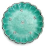 A GUSTAVSBERG, SWEDEN SHALLOW GREEN GLAZED SCALLOP-EDGE SMALL DISH with silver delicate flower spray