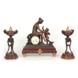 A LATE 19TH CENTURY FRENCH FIGURAL CLOCK GARNITURE surmounted with a patinated metal classical