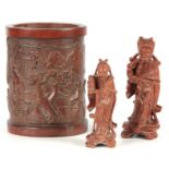 A 19TH CENTURY CHINESE BAMBOO BRUSH POT carved with continuous figures in a landscape scene 17cm